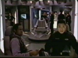 Kevin helps Matheson figure out the layout of the alien bodies