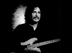 [Frank Zappa playin' guitar]