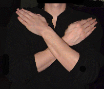 Arms folded across torso.