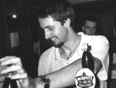 James_looks_amused_at_his_'spitting_in_the_beer'_gag