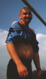 Kevin_struggles_to_get_his_shirt_over_his_gut