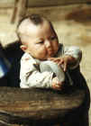 Baby in a butter churn