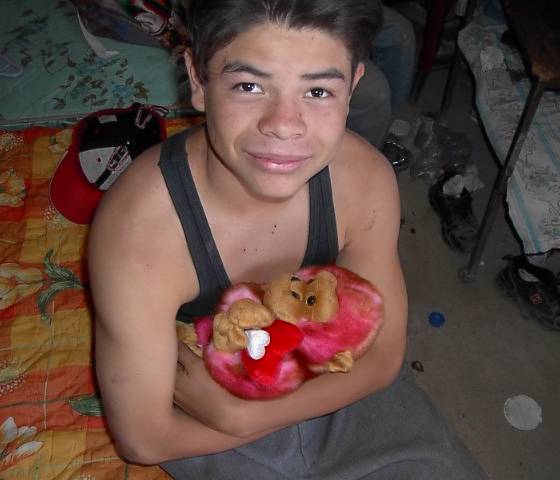 Sergio holding his baby.  Doesn't he look handsome?