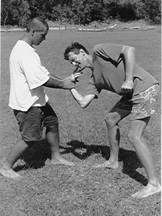 Dai Sempai Matthew Spoljarevic performing a wristlock on Peter Woltmann, utalizing Pressure Point Triple Heater 3