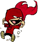 a little boy dressed in a red suit