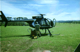The Hughes 500 refueling between the searches.
