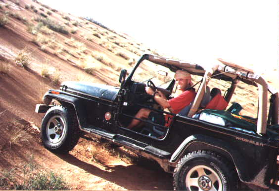 Sven and Luc Staal challenging a Wahiba dune in Sven's Jeep Wrangler
