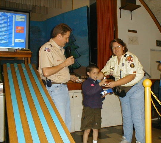 receiving the 4th place trophy in the Tigers/Wolf Division