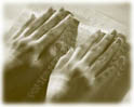 Hands reading braille
