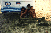 Christine, Jana and I with the sand castle we built