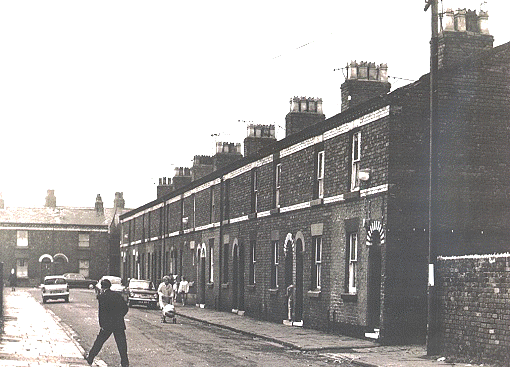 Two sides of Cadogan St which was once known as Piggy Muck Square.  This picture was ytaken in 1970 and the hoses were demolished soon after having been in use for about 100 years.